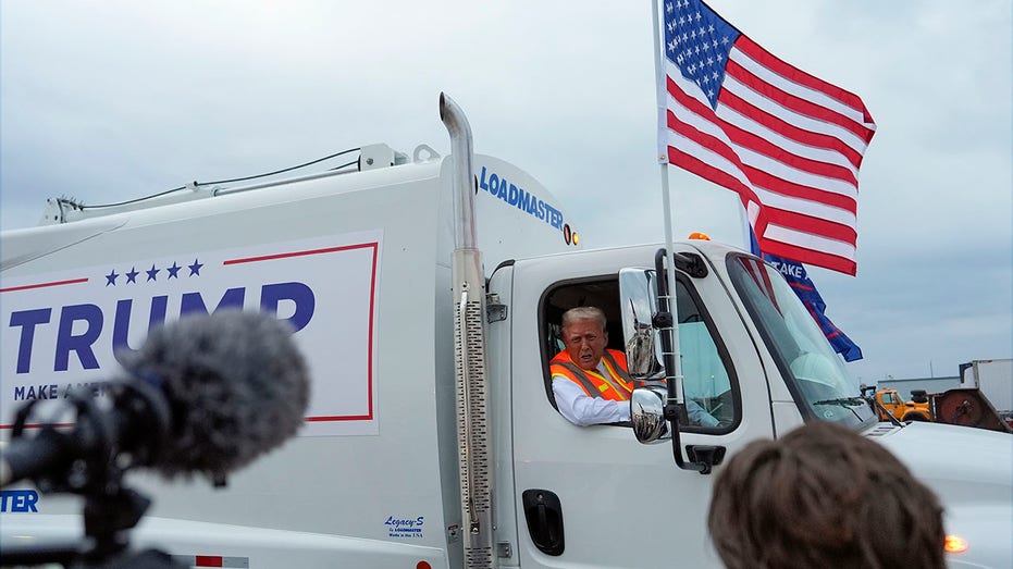 Trump hits Wisconsin in garbage truck ‘in honor of Kamala and Joe Biden’