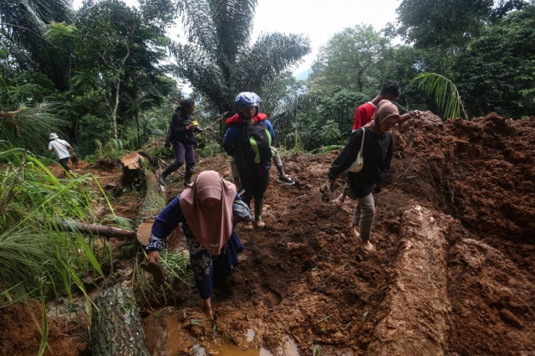 Rescuers in Indonesia search for survivors after landslide kills 19 in Java